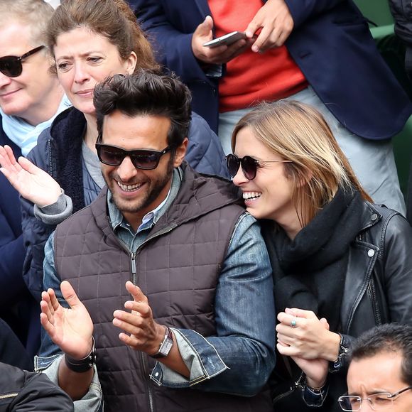 Maxim Nucci (Yodelice) et sa compagne Isabelle Ithurburu dans les tribunes des Internationaux de France de tennis de Roland Garros à Paris. Le 24 mai 2016 
© Dominique Jacovides / Bestimage