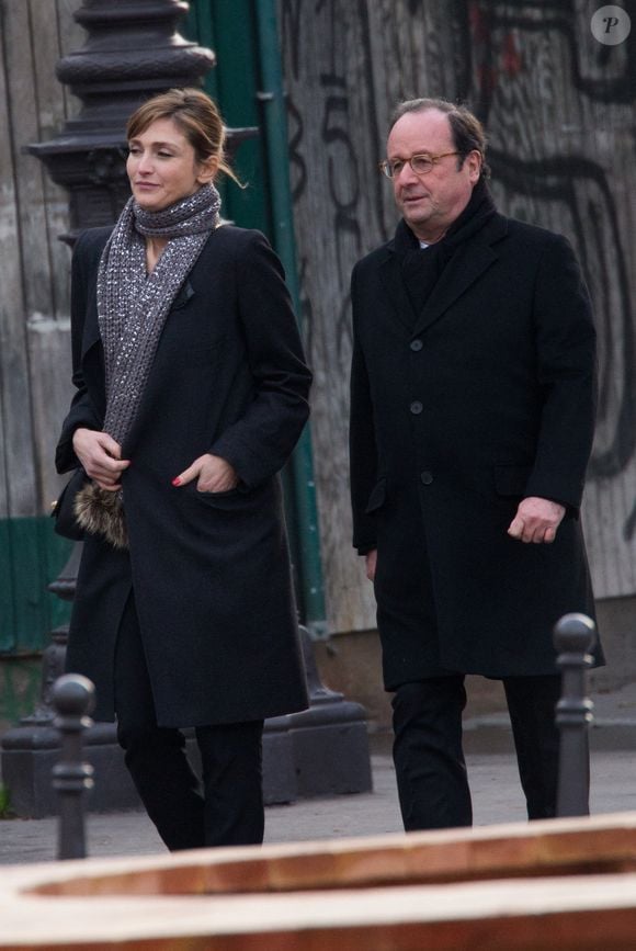 Francois Hollande et Julie Gayet quittent la cérémonie funéraire organisée en mémoire de Johnny Hallyday à Paris. Photo par Berzane-Wyters/ABACAPRESS.COM