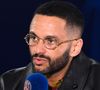 Il s'agit de Malik Bentalha.

Malik Bentalha - Célébrités dans les tribunes du match aller des huitièmes de finale de la Ligue des champions entre le PSG et la Real Sociedad (2-0) au Parc des Princes à Paris le 14 février 2024.