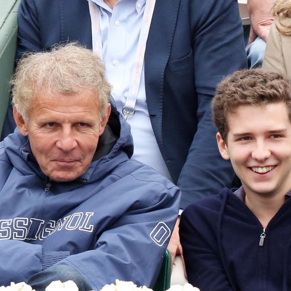 Patrick Poivre D'Arvor et son fils Francois - People assistent au 8 eme sacre de Rafael Nadal lors des Internationaux de France a Roland Garros a Paris le 9 juin 2013. Rafael Nadal remporte son 8eme Roland Garros en battant l'espagnol David Ferrer. © Jacovides / Agence / Bestimage