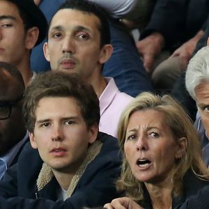 Exclusif - Claire Chazal avec son fils François Poivre d'Arvor et un ami le banquier Christophe de Backer assistent au quart finale de la Ligue des Champions de football au Parc des Princes entre le PSG et le FC Barcelone à Paris le 15 avril 2015. © Jacovides Moreau Bestimage