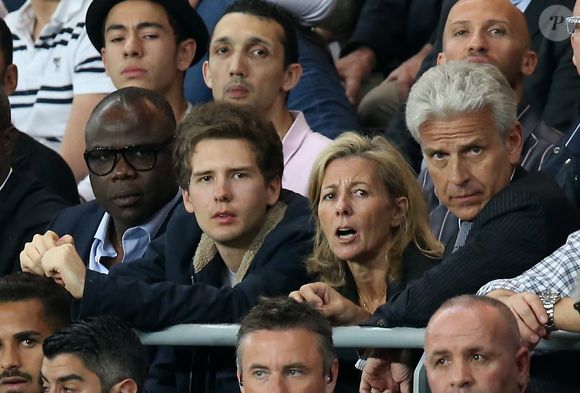 Exclusif - Claire Chazal avec son fils François Poivre d'Arvor et un ami le banquier Christophe de Backer assistent au quart finale de la Ligue des Champions de football au Parc des Princes entre le PSG et le FC Barcelone à Paris le 15 avril 2015. © Jacovides Moreau Bestimage