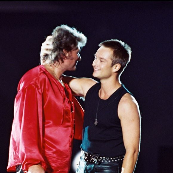 Johnny et David Hallyday lors d'un concert au parc des Princes pour fêter son 50e anniversaire. ©Bestimage