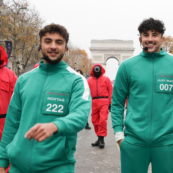 Inoxtag, Just Riadh et Maghla  - La plus belle avenue du monde va célébrer la sortie de la saison 2 de Squid Game en revisitant l'une de ses épreuves mythiques, 1,2,3 Soleil, à laquelle participeront 423 heureux volontaires dont les influenceurs Inoxtag, Maghla, Nicotine et Just Riadh sur l'Avenue des Champs-Élysées, à Paris, rRance, le 1er décembre 2024. © Coadic Guirec/Bestimage