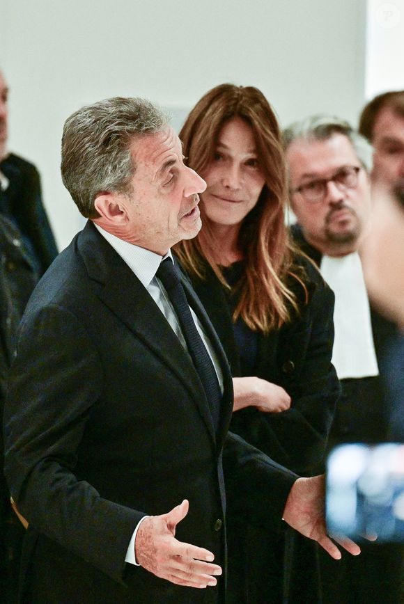Nicolas Sarkozy et sa femme Carla Bruni - Nicolas Sarkozy condamné à 5 ans de prison à l'issue du procès de l'affaire du financement libyen au tribunal correctionnel de Paris, le 25 septembre 2025. L'ancien chef de l'Etat était accompagné de sa femme, C.Bruni. Nicolas Sarkozy, jugé coupable d’association de malfaiteurs, sera prochainement convoqué en vue de lui signifier la date de son incarcération. 
© Christian Liewig / Bestimage