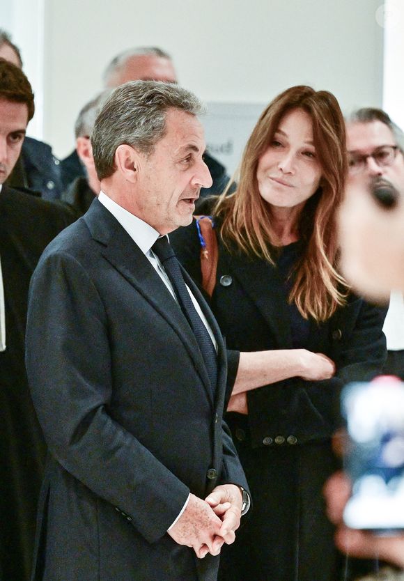 Nicolas Sarkozy et sa femme Carla Bruni - Nicolas Sarkozy condamné à 5 ans de prison à l'issue du procès de l'affaire du financement libyen au tribunal correctionnel de Paris, le 25 septembre 2025. L'ancien chef de l'Etat était accompagné de sa femme, C.Bruni. Nicolas Sarkozy, jugé coupable d’association de malfaiteurs, sera prochainement convoqué en vue de lui signifier la date de son incarcération. 
© Christian Liewig / Bestimage