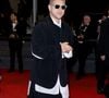 Pour Sanguine, il optait pour un ensemble noir structuré façon kimono ; pour Karma, il misait sur un costume blanc oversize très architectural.


Mosimann - Montée des marches du film " Sanguine " lors du 79ème Festival International du Film de Cannes, le 14 mai 2026. © Olivier Borde / Bestimage