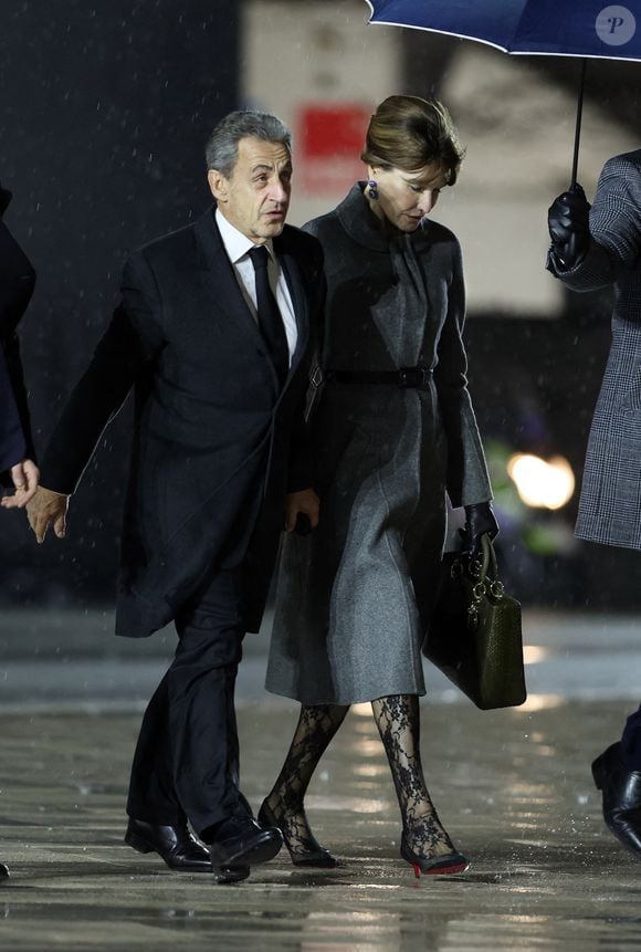 Nicolas Sarkozy et sa femme Carla Bruni - Arrivées à la cérémonie de réouverture de la cathédrale Notre-Dame de Paris, le 7 décembre 2024. Joyau de l’art gothique, lieu de culte et de culture, symbole universel de la France et de son histoire, la cathédrale de Notre-Dame de Paris rouvre ses portes les 7 et 8 décembre, cinq ans après le terrible incendie qui l’avait ravagée le 15 avril 2019. 
© Agence / Bestimage