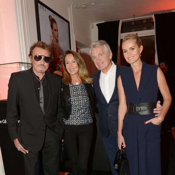 Exclusif - Johnny Hallyday, Nicole et Gilbert Coullier, Laeticia Hallyday - Inauguration du Show Room Parisien De Grisogono et lancement de la montre "Crazy Skull" à Paris le 23 octobre 2014.