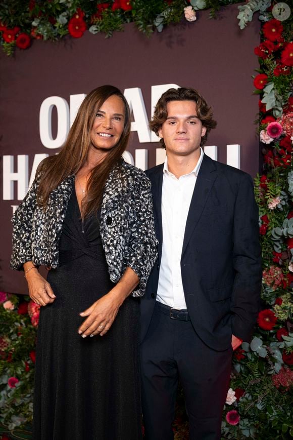 Nathalie Marquay-Pernaut et son fils Tom au photocall de la soirée Omar Harfouch "Dîner chez Maxim's" à Paris le 9 octobre 2024. © Perusseau / Tribeca / Bestimage