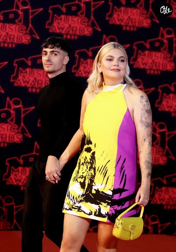 Un accomplissement majeur célébré avec beaucoup d'émotion sur les réseaux sociaux, sous le regard admiratif de sa belle.

Florian Rossi et sa compagne Louane Emera lors de la 23ème édition des NRJ Music Awards 2021 au Palais des Festivals de Cannes, le 20 novembre 2021.
© Dominique Jacovides/Bestimage