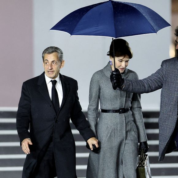 Nicolas Sarkozy et sa femme Carla Bruni arrivent à la cérémonie de réouverture de la cathédrale Notre-Dame de Paris, le 7 décembre 2024. 

© Agence / Bestimage