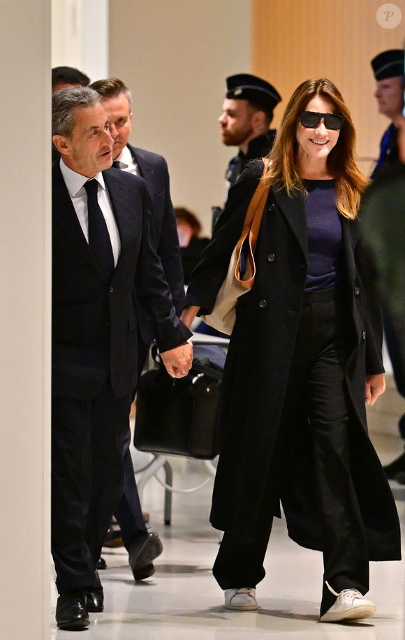 Nicolas Sarkozy et sa femme Carla Bruni au Tribunal judiciaire (Batignolles, 32ème chambre correctionnelle) pour l'annonce de la décision dans le cadre du procès Lybien.  © Christian Liewig / Bestimage