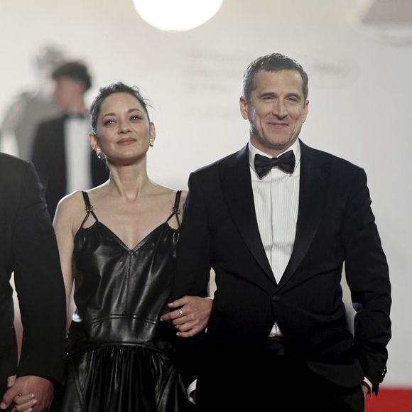 Marion Cotillard et Guillaume Canet - Descente des marches du film " Karma " lors du 79ème Festival International du Film de Cannes, le 15 mai 2026. © Jacovides-Moreau / Bestimage