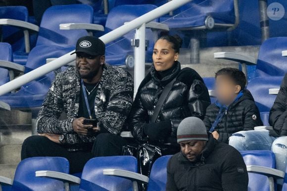Cindy Bruna et son nouveau compagnon Serge Ibaka - Célébrités dans les tribunes du quart de finale de la Ligue des Nations de l'UEFA 2025 "France - Croatie (2-0 / tab 5-4)" au Stade de France à Saint-Denis le 23 mars 2025. © Cyril Moreau/Bestimage