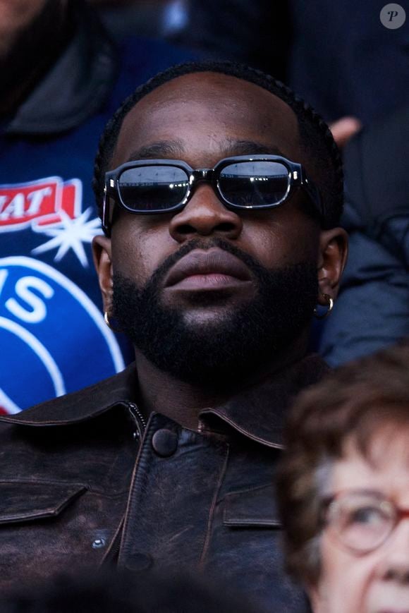 Tayc dans les tribunes de la demi-finale retour de Ligue des champions entre le PSG face au Borussia Dortmund au Parc des Princes à Paris le 7 mai 2024. © Cyril Moreau/Bestimage