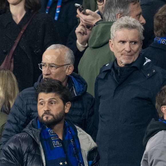 Christophe Beaugrand, Gilles Bouleau et Denis Brogniart - Célébrités dans les tribunes du quart de finale de la Ligue des Nations de l'UEFA 2025 "France - Croatie (2-0 / tab 5-4)" au Stade de France à Saint-Denis le 23 mars 2025. © Cyril Moreau/Bestimage