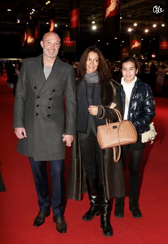 Frank Leboeuf avec sa compagne Chrislaure Nollet (ex-femme de Fabrice Santoro) et la fille de celle-ci Djenae - Gucci Paris Masters 2013 a Villepinte le 8 decembre 2013.
Crédit : JLPPA / Bestimage