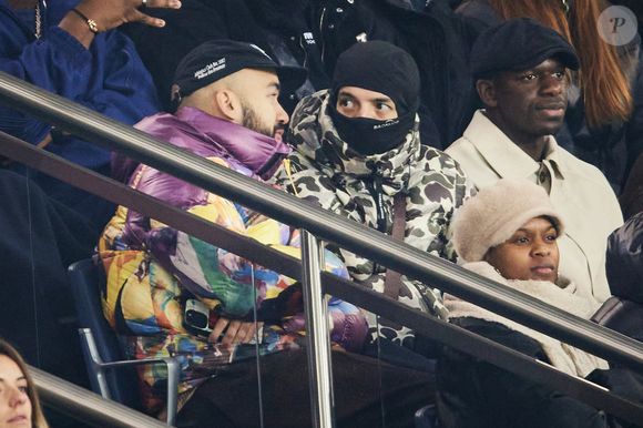 Bigflo et Oli - Célébrités dans les tribunes lors du match de Ligue 1 McDonald's opposant le Paris Saint-Germain (PSG) à l'Olympique de Marseille (OM) - (3-1) au Parc des Princes à Paris le 16 mars 2025. © Cyril Moreau/Bestimage
