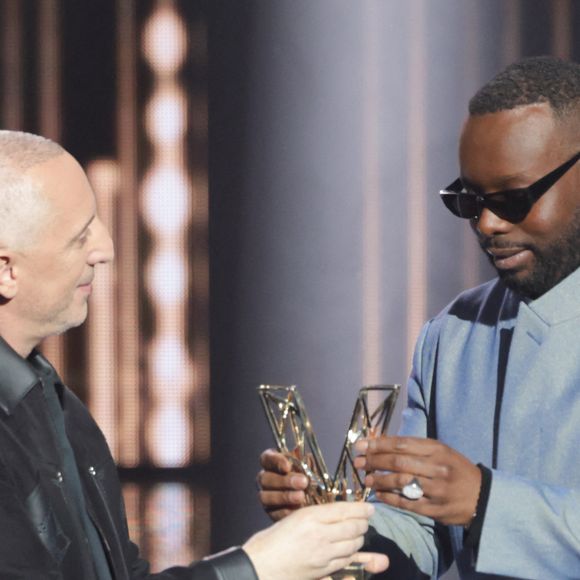 Gad Elmaleh et Gims - Cérémonie de la 40ème édition des Victoires de la Musique à la Seine Musicale à Boulogne-Billancourt, France, le 14 février 2025. © Coadic Guirec/Bestimage