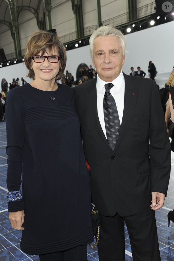 Avec sa femme, il vit à Bormes-les-Mimosas

Michel Sardou et son épouse Anne-Marie Perier assistent au défilé de la collection prêt-à-porter printemps-été 2013 de Chanel qui s'est tenu au Grand Palais à Paris, France, le 2 octobre 2012. Photo by Thierry Orban/ABACAPRESS.COM