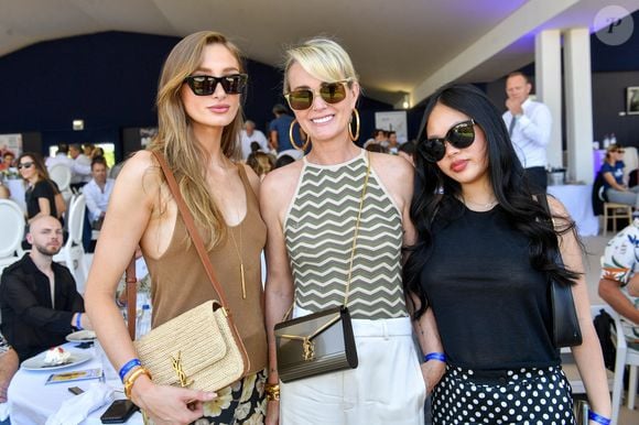 Exclusif -  Mathilde Pinault, Laeticia Hallyday et sa fille Joy dans l'Espace VIP lors de la 9ème édition du "Longines Paris Eiffel Jumping" au Champ de Mars à Paris, France, le 25 juin 2023. © Perusseau-Veeren/Bestimage