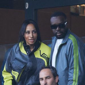 Gims et sa femme Demdem dans les tribunes de la demi-finale retour de Ligue des champions entre le PSG face au Borussia Dortmund (0-1) au Parc des Princes à Paris le 7 mai 2024.

© Cyril Moreau/Bestimage
