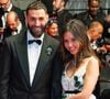 Karim Benzema et sa compagne Lyna Khoudri ont scellé leurs destins
Karim Benzema et sa compagne Lyna Khoudri à la descente des marches du film « 13 jours 13 nuits » lors du 78ème Festival International du Film de Cannes.
© Backgrid USA/ Bestimage