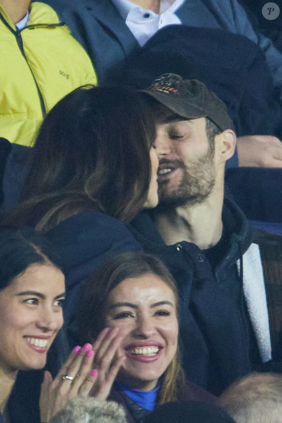 Exclusif - Louis Sarkozy et sa femme Natali Husic   - People en tribunes du match de Ligue 1 Uber Eats "PSG contre Reims" (1-1) au Parc des Princes à Paris le 29 janvier 2023. (AGENCE / BESTIMAGE).