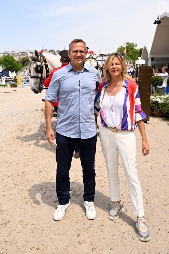 Patrick Karam, Conseiller régional d’Île-de-France et Virginie Coupérie-Eiffel lors de l'arrivée de la Route Eiffel Présentée par la Région Ile-de-France lors du Longines Paris Eiffel Jumping au pied de la Tour Eiffel sur le Champ-de-Mars à Paris, France, le 22 juin 2025.

© Perusseau-Veeren/Bestimage
