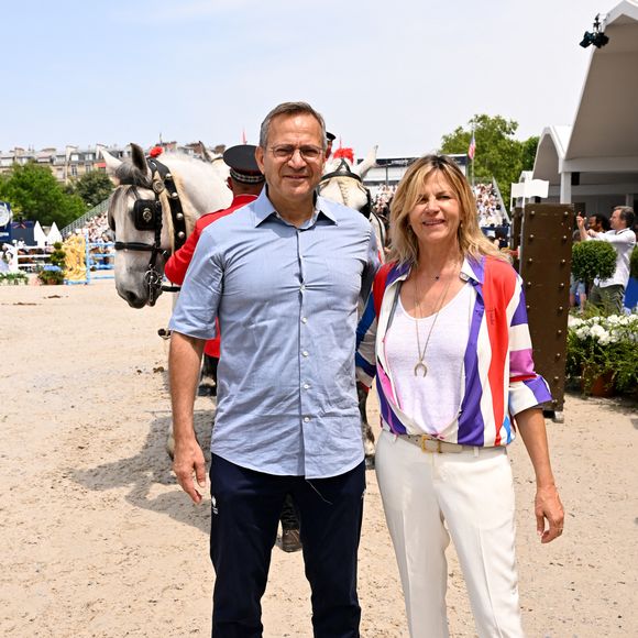 Patrick Karam, Conseiller régional d’Île-de-France et Virginie Coupérie-Eiffel lors de l'arrivée de la Route Eiffel Présentée par la Région Ile-de-France lors du Longines Paris Eiffel Jumping au pied de la Tour Eiffel sur le Champ-de-Mars à Paris, France, le 22 juin 2025.

© Perusseau-Veeren/Bestimage