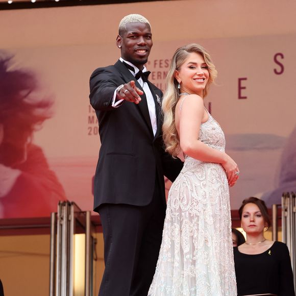 En fait, ils ont sorti une collection de bijoux en collaboration avec Elke Berr

Zulay Pogba et son mari Paul Pogba - Montée des marches du film « Highest 2 Lowest » lors du 78ème Festival International du Film de Cannes, au Palais des Festivals à Cannes. Le 19 mai 2025
© Jacovides-Moreau / Bestimage