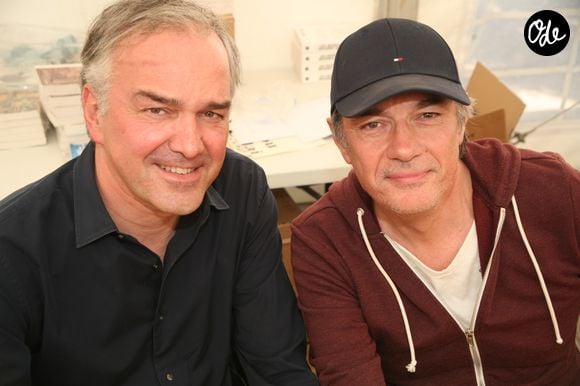 Olivier Truchot et Alain Marschall lors du salon du livre de Cosne-sur-Loire le 26 mai 2019.

© Jlppa / Bestimage