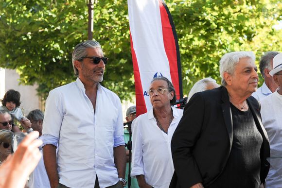 Exclusif - Ary Abittan, Félix Gray, Enrico Macias - Personnalités à l'exposition photographique de Paris Match "Eddie Barclay — Saint-Tropez, le sens de la fête !" place Blanqui à Saint-Tropez le 11 juillet 2025.

© Eternity / Bestimage