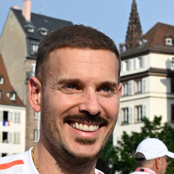 Le chanteur Matt Pokora assiste au relais de la flamme olympique à Strasbourg, dans le nord-est de la France, le 26 juin 2024. 36 relayeurs ont porté la flamme sur 200 m, le long d'un parcours de 7,2 km, du Parlement européen à la place Kleber. Photo par Nicolas Roses/ABACAPRESS.COM
