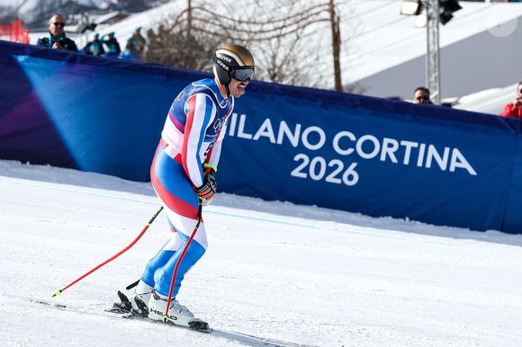 Il a déjà commenté la descente de son fils Nils, qui a fini 22e à Bormio malgré une blessure à la main.

Le 7 février 2026, Cortina D'ampezzo, Italie : Nils Alphand (FRA) lors de la descente masculine de ski alpin des Jeux Olympiques d'hiver de Milano-Cortina 2026 le 7 février 2026 au centre de ski Stelvio à Bormio, Italie. Sergio Bisi/LiveMedia-IPA/ZUMA Press Wire/Bestimage)