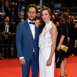 Thomas Hollande, sa femme Emilie Broussouloux - Montée des marches du film "R.M.N." lors du 75ème Festival International du Film de Cannes, le 21 mai 2022.
© Cyril Moreau / Bestimage