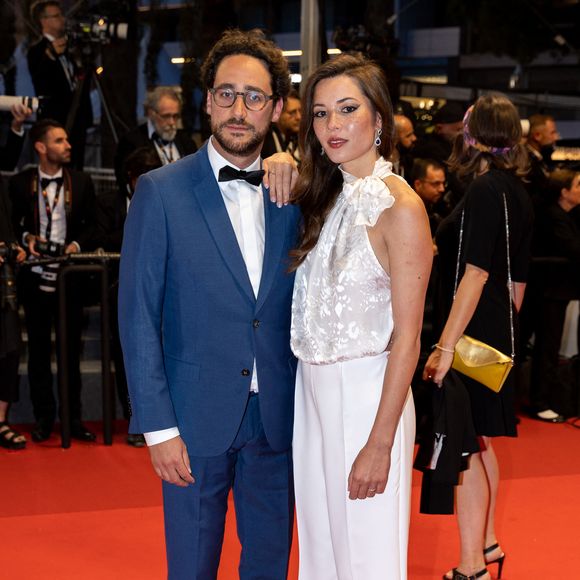Thomas Hollande, sa femme Emilie Broussouloux - Montée des marches du film "R.M.N." lors du 75ème Festival International du Film de Cannes, le 21 mai 2022.
© Cyril Moreau / Bestimage