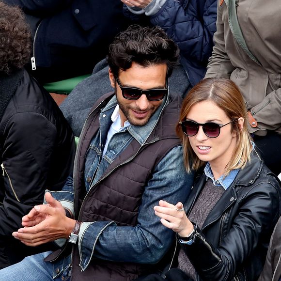 Maxim Nucci (Yodelice) et sa compagne Isabelle Ithurburu dans les tribunes des Internationaux de France de tennis de Roland Garros à Paris. Le 24 mai 2016 
© Dominique Jacovides / Bestimage