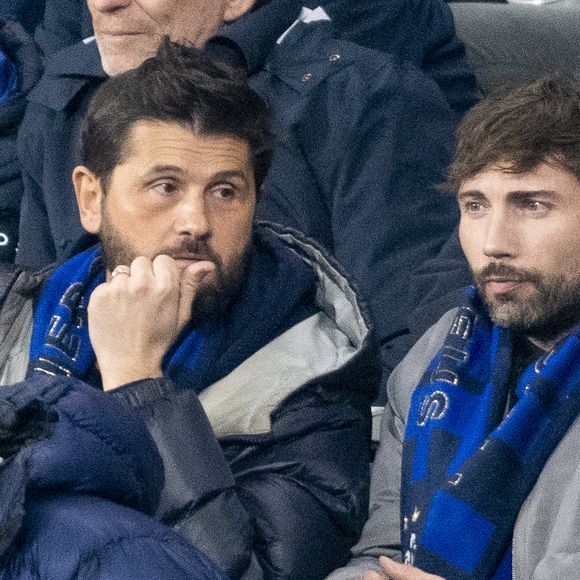 Christophe Beaugrand et son mari Ghislain Beaugrand-Gerin - Célébrités dans les tribunes du quart de finale de la Ligue des Nations de l'UEFA 2025 "France - Croatie (2-0 / tab 5-4)" au Stade de France à Saint-Denis le 23 mars 2025. © Cyril Moreau/Bestimage