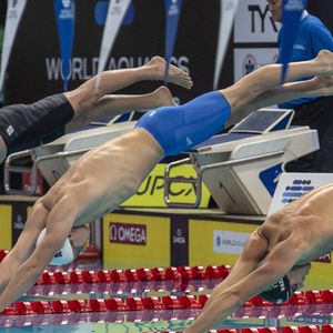Leon Marchand, of France middle, dives into the pool at the Mens 200m Individual Medley at the on 1 November, 2024. The World Aquatics Swimming World Cup holds its finale for 2024 in Singapore from October 31 to November 02.