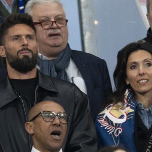 Olivier Giroud et sa femme Jennifer Giroud, Philippe Diallo - Célébrités dans les tribunes du quart de finale de la Ligue des Nations de l'UEFA 2025 "France - Croatie (2-0 / tab 5-4)" au Stade de France à Saint-Denis le 23 mars 2025. © Cyril Moreau/Bestimage