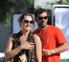 Au printemps dernier, c’est lui qui avait besoin de se dégager du temps pour son projet professionnel [un tournoi de tennis adossé au country club que son mari 

L'actrice française Mélanie Maudran et son mari l'ancien joueur de tennis Thierry Ascione aux Internationaux de France de Tennis à Roland Garros à Paris, France le 17 mai 2011. Photo par Corinne Dubreuil/ABACAPRESS.COM