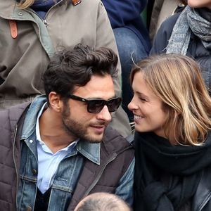 Maxim Nucci (Yodelice) et sa compagne Isabelle Ithurburu dans les tribunes des Internationaux de France de tennis de Roland Garros à Paris. Le 24 mai 2016 
© Dominique Jacovides / Bestimage