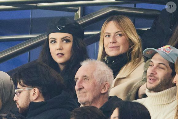 Just Riahd, Hoshi dans les tribunes lors du match de Ligue Des Champions 2024-2025 (LDC) "PSG - Brest (7-0)" au Parc Des Princes, le 19 février 2025.
© Cyril Moreau/Bestimage