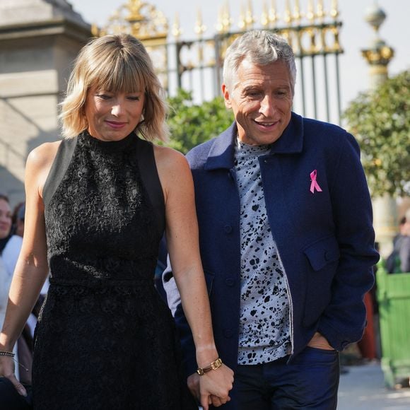 Nagui et sa femme Mélanie Page assistant au défilé Christian Dior Womenswear Spring/Summer dans le cadre de la semaine de la mode à Paris à Paris, France.  (Photo par Lucia Sabatelli / Bestimage)