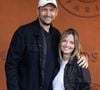 Mais lorsqu’il s’agit de ses fils, Éric Antoine refuse de leur imposer son propre régime alimentaire.

Eric Antoine et sa femme Gennifer Demey au village lors des Internationaux de France de Tennis de Roland Garros 2026. Paris, le 2 juin 2026. © Jacovides-Moreau / Bestimage
