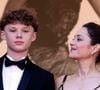Elle a confié : "C'était pas du tout prévu en fait, et puis on s'est retrouvé en haut des marches tous les deux, l'un à côté de l'autre. Je suis une mère très protectrice."

Marcel Canet et sa mère Marion Cotillard - Montée des marches du film " Karma " lors du 79ème Festival International du Film de Cannes, le 15 mai 2026. © Jacovides-Moreau / Bestimage