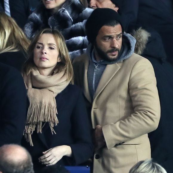 Maxim Nucci et sa compagne Isabelle Ithurburu enceinte assistent au huitième de finale retour de Ligue des Champion, du Paris Saint-Germain contre le Real Madrid au Parc des Princes à Paris le 6 mars 2018. © Cyril Moreau/Bestimage