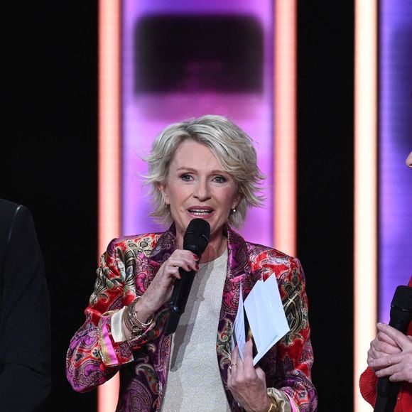 Cyril Feraud, animateur de télévision français, Sophie Davant, journaliste et animatrice radio et TV et Laurence Tiennot-Herment, présidente de l'AFM lors du Téléthon 2023, à Saint Denis, près de Paris, France le 8 décembre 2023. Photo par Tomas Stevens/ABACAPRESS.COM